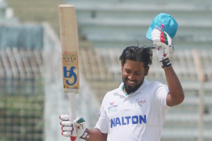 Central Zone's batsman Abdul Mazid celebrating after hitting a century against East Zone on the 1st day of the four-day first class BCL match at the Shahid Kamruzzaman Stadium in Rajshahi on Tuesday	— UNB