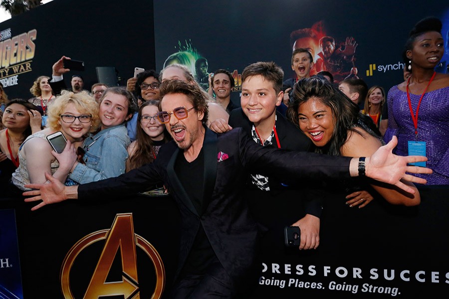 Actor Robert Downey Jr. poses with fans - Reuters/File