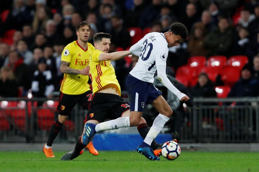 Premier League - Tottenham Hotspur v Watford - Wembley Stadium, London, Britain - April 30, 2018 Tottenham's Dele Alli in action with Watford's Craig Cathcart. Action Images via Reuters.