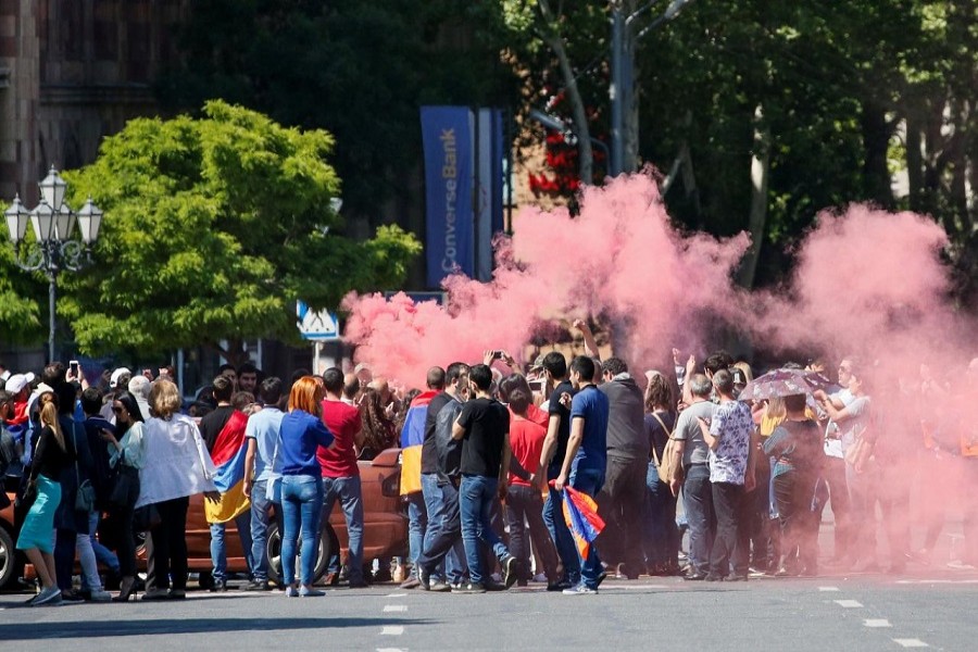 Armenian opposition supporters light a flare as they block a road, after protest movement leader Nikol Pashinyan announced a nationwide campaign of civil disobedience in Yerevan, Armenia May 2, 2018. - Reuters