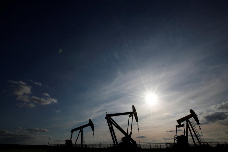 Oil pumps are seen at sunset outside Vaudoy-en-Brie, near Paris, France April 23, 2018. Reuters