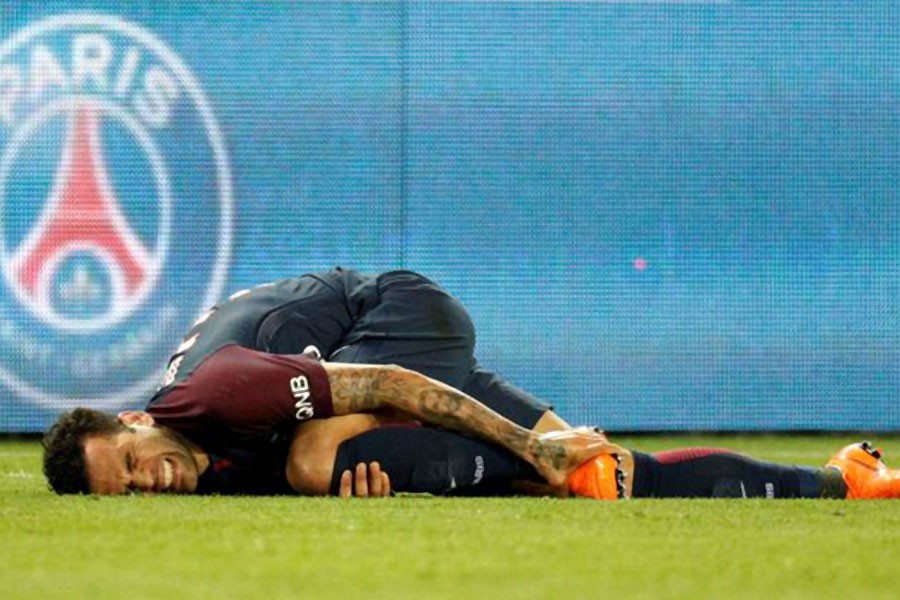 Paris Saint-Germain’s Dani Alves after sustaining an injury. Reuters.