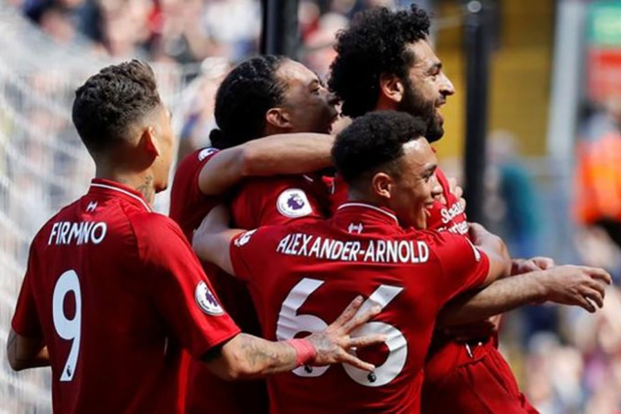 Salah sets record as Liverpool ensures CL spot