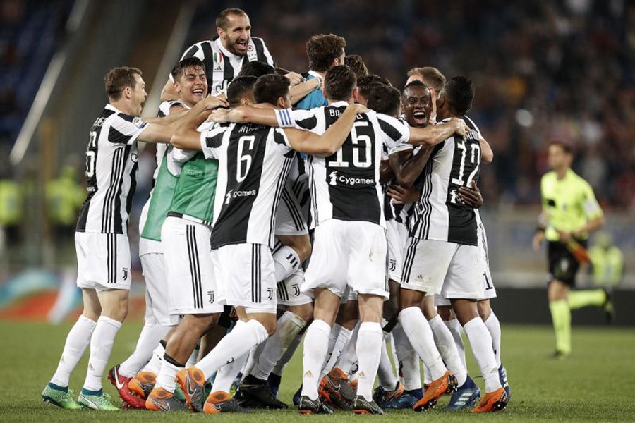 Juventus players celebrating at the end of the Serie A soccer match against Roma at the Rome Olympic stadium on Sunday	— AP