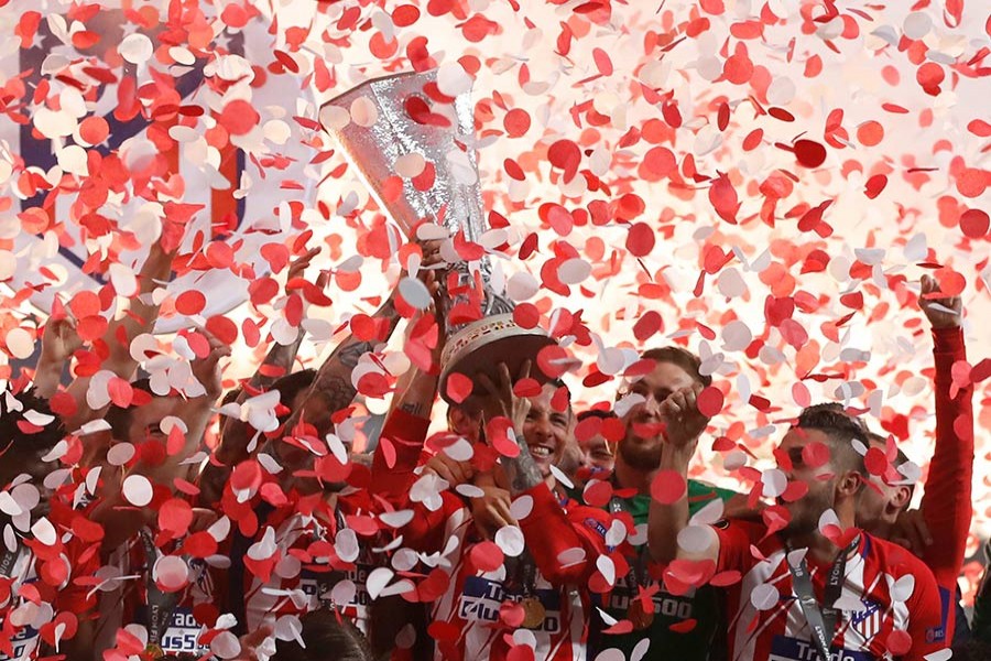 Atletico Madrid players celebrate with the trophy after winning the Europa League on Wednesday