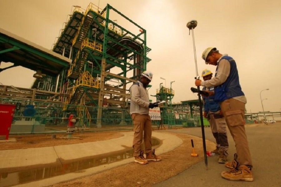 A worker walks at the Zubair oilfield in Basra, Iraq May 9, 2018. Reuters/Files