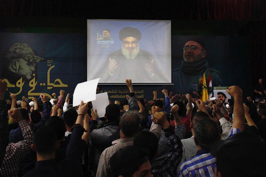 Lebanon's Hezbollah leader Sayyed Hassan Nasrallah is seen on a video screen as he addresses his supporters in Beirut, Lebanon on Monday - Reuters photo