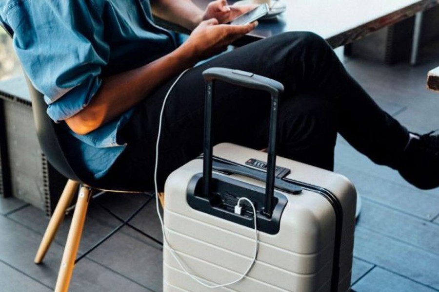 Internet photo shows a person charging his phone through a smart luggage