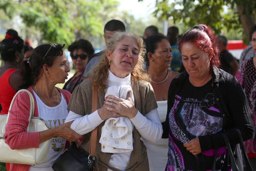 Relatives of victims of the Boeing 737 plane that crashed after taking off from Havana's main airport on Friday, react as they leave the Legal Medical Institute in Havana, Cuba on Saturday - Reuters photo