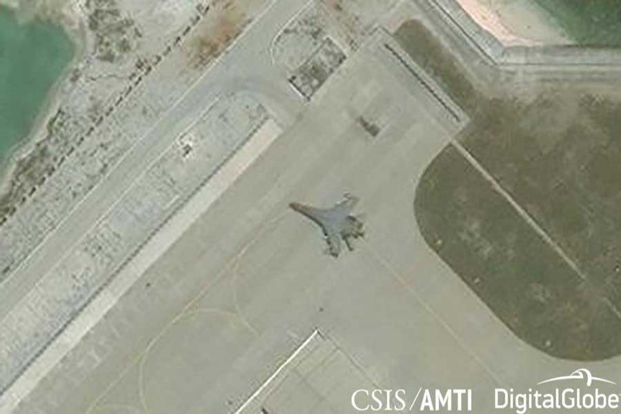 Satellite imagery shows what the CSIS Asia Maritime Transparency Initiative describes as the deployment of several new weapons systems, including a J-11 combat aircraft, at China’s base on Woody Island in the Paracels, South China Sea May 12, 2018.Courtesy CSIS Asia Maritime Transparency Initiative/DigitalGlobe/Handout via Reuters