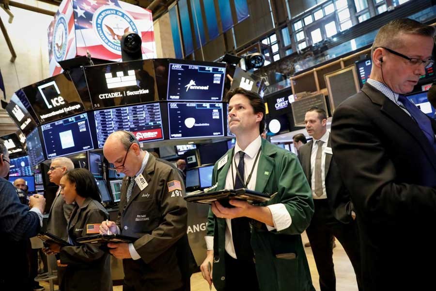 Traders work on the floor of the New York Stock Exchange (NYSE) in New York, US, May 21, 2018. Reuters