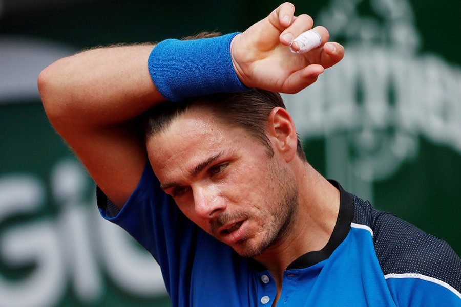 Switzerland's Stan Wawrinka during his first round match against Spain's Guillermo Garcia-Lopez on Monday - Reuters photo