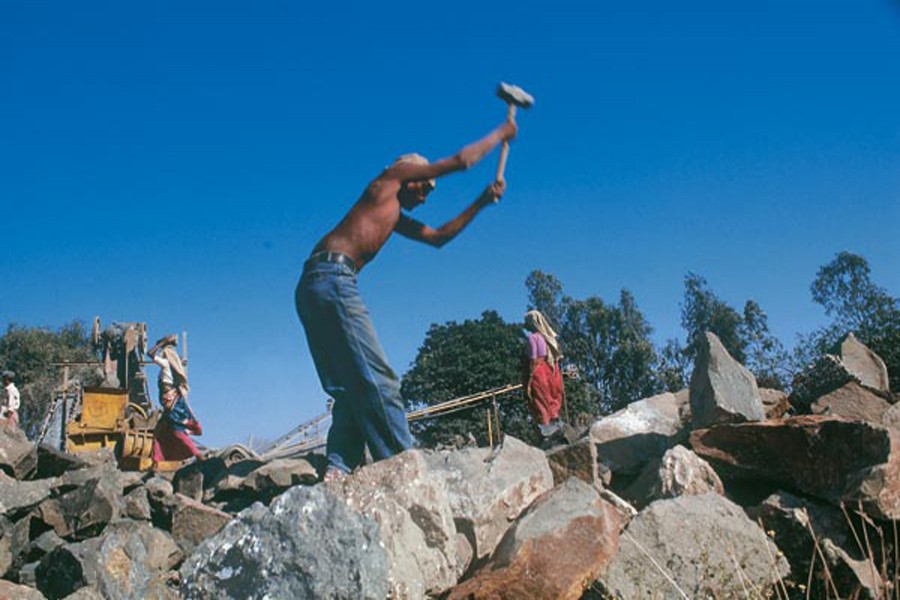 Stone is mined, broken and crushed using mostly manual labour. Gujarat, India 1997. Representational image of hard labour