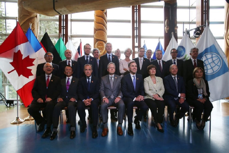 Delegates pose for an official photo at the G7 Finance Ministers Summit in Whistler, British Columbia, Canada, June 1, 2018. Reuters