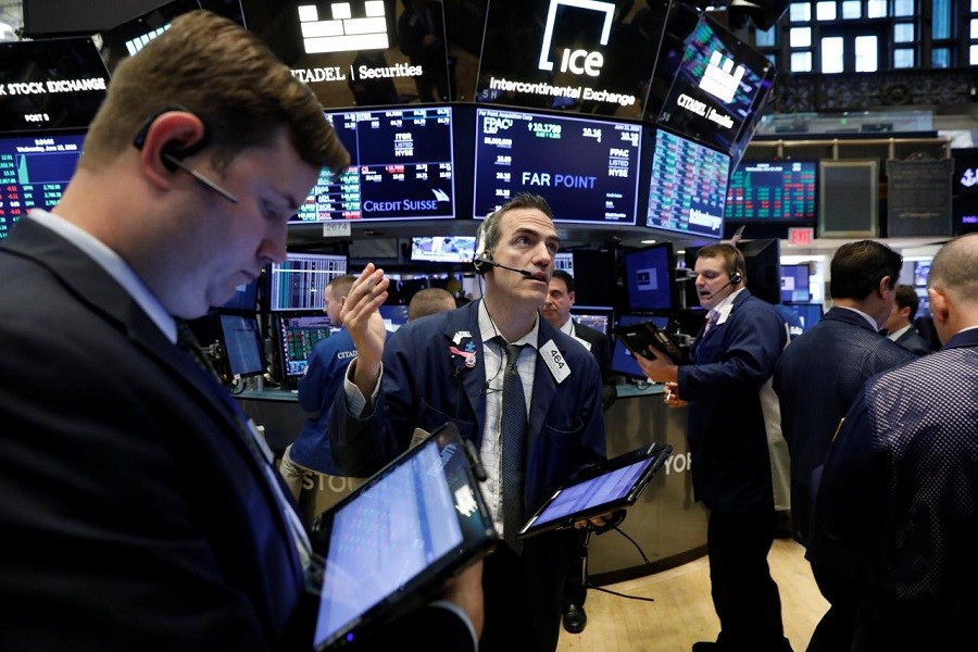 Traders work on the floor of the New York Stock Exchange (NYSE) in New York, US, June 13, 2018. Reuters/Files