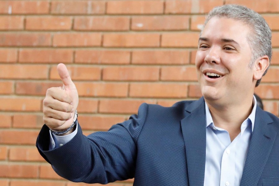 Presidential candidate Ivan Duque gestures after casting his vote at a polling station, during the presidential election in Bogota, Colombia June 17, 2018. Reuters.