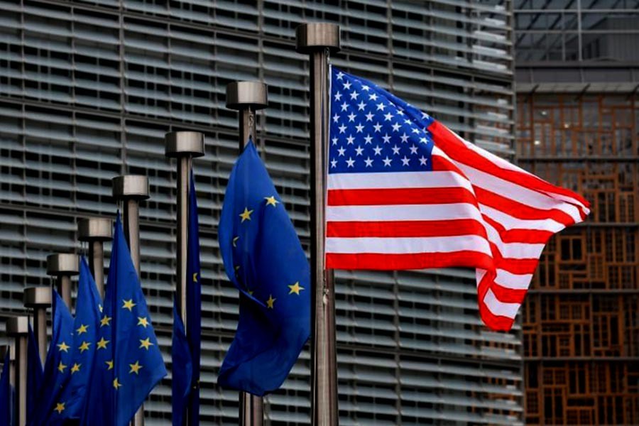 US and European Union flags in front of the European Commission headquarters in Brussels of Belgium. -Reuters Photo