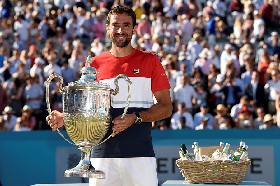 Croatia's Marin Cilic celebrates with the trophy after winning the Queen's Club final against Serbia's Novak Djokovic - Reuters photo