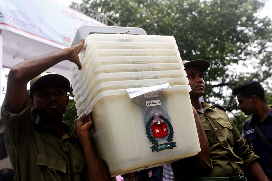 Ansar members carrying ballot boxes and other election materials (not in the frame) to a polling centre in Gazipur on Monday, a day before the Gazipur City Corporation election   -Photo: Focus Bangla