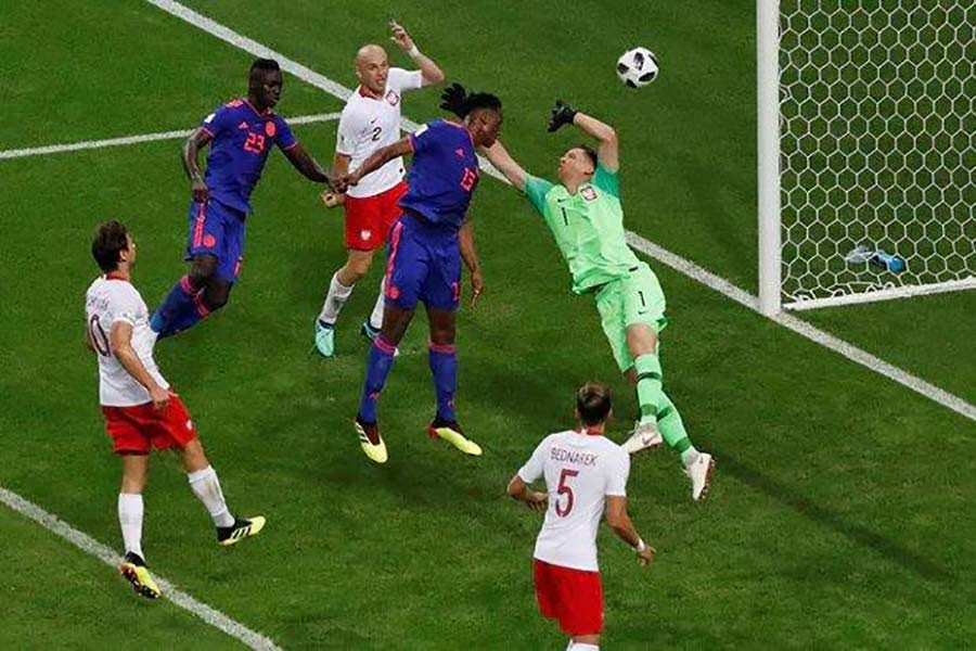 Yerry Mina rises for Colombia's first goal against Poland in FIFA World Cup match in Russia on June 24. -Reuters Photo