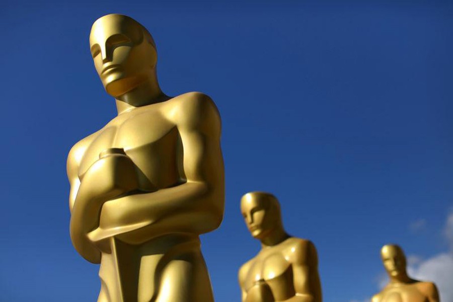 Oscar statues dry in the sunlight after receiving a fresh coat of gold paint as preparations begin for the 89th Academy Awards in Hollywood, California, US, February 22, 2017. Reuters/File Photo