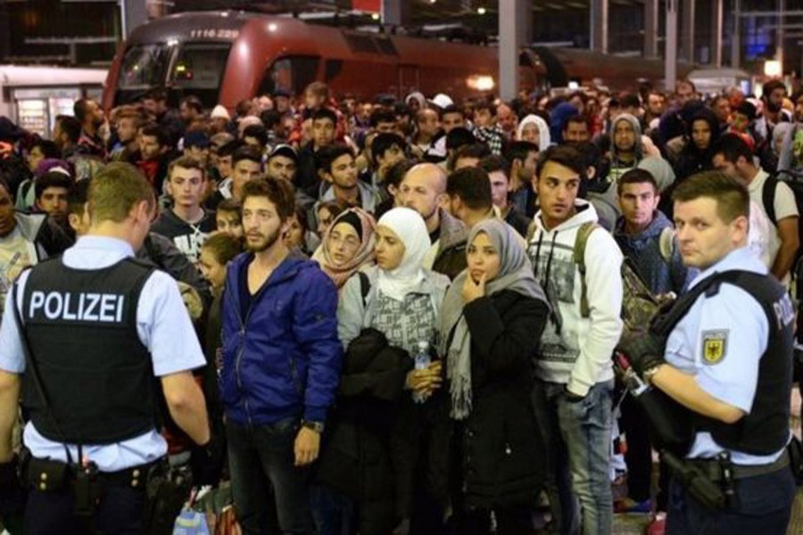 Migrants arriving in Munich, 12 September 2015. BBC file photo