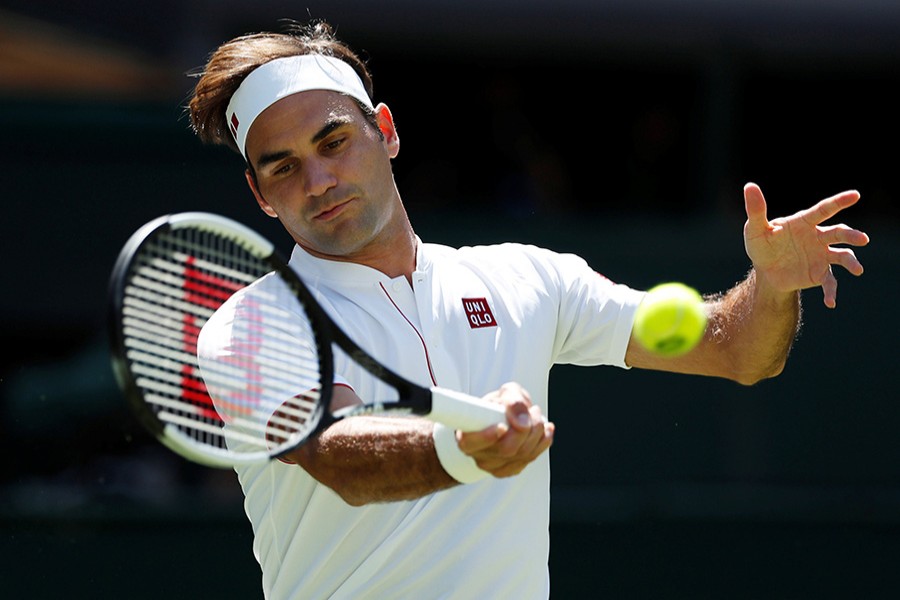 Federer wearing his new Uniqlo tennis outfit at Wimbledon on Monday - Reuters photo