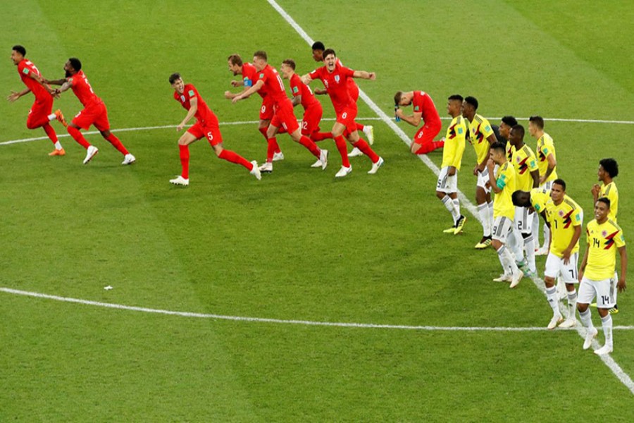 England players celebrate while Colombians cut dejected figures after penalty shootout - Reuters photo