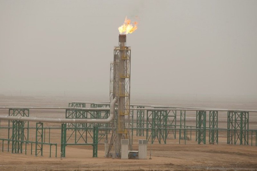 Excess gas being burnt off at a pipeline at the Zubair oilfield in Basra, Iraq 	— Reuters