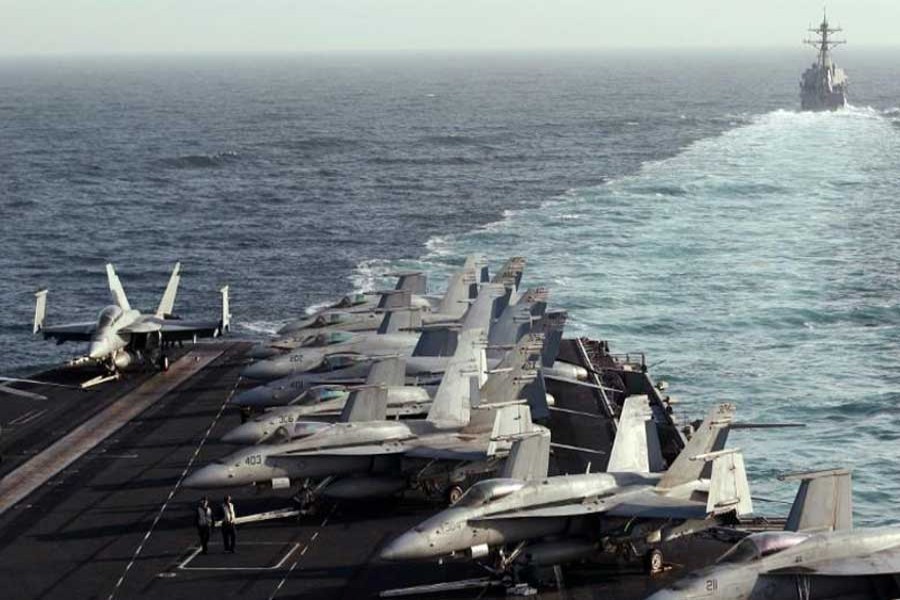 The Sterett Destroyer escorts the Nimitz-class aircraft carrier USS Abraham Lincoln (CVN 72) during a transit through the Strait of Hormuz, February 14, 2012. Reuters/File Photo