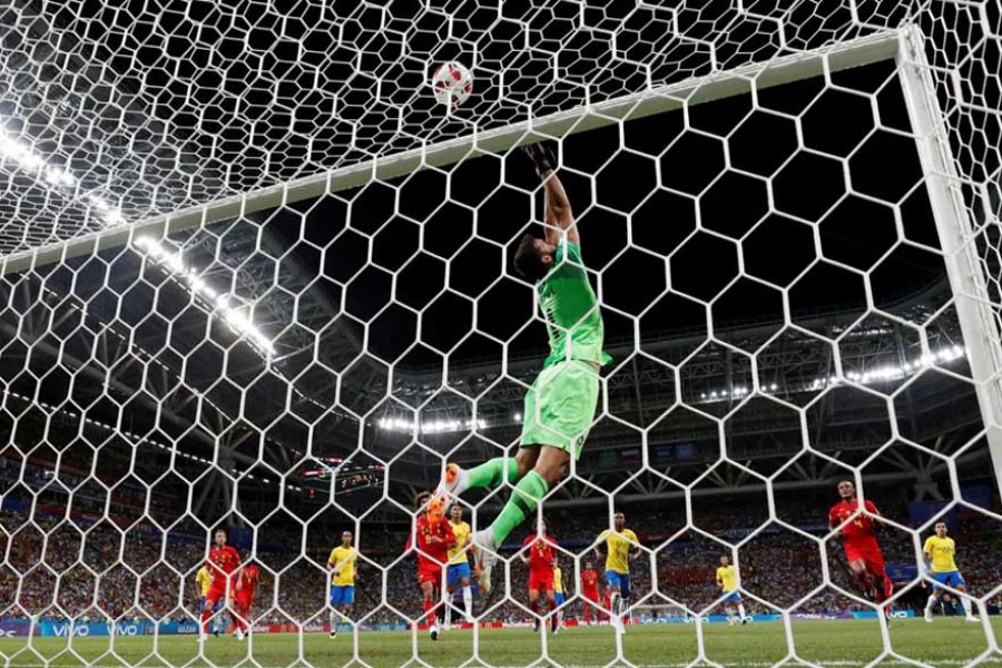 Football - World Cup - Quarter Final - Brazil vs Belgium - Kazan Arena, Kazan, Russia - July 6, 2018 Brazil's Alisson makes a save. Reuters