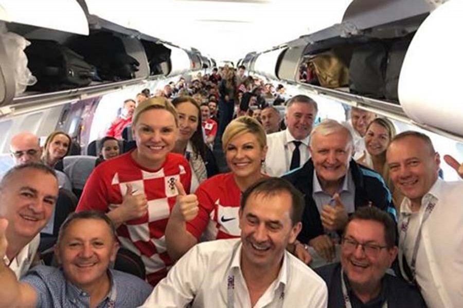 Croatian President Kolinda Grabar-Kitarovic takes a photo with passengers aboard a Jul 1 flight to Russia. Photo: Kolinda Grabar-Kitarović