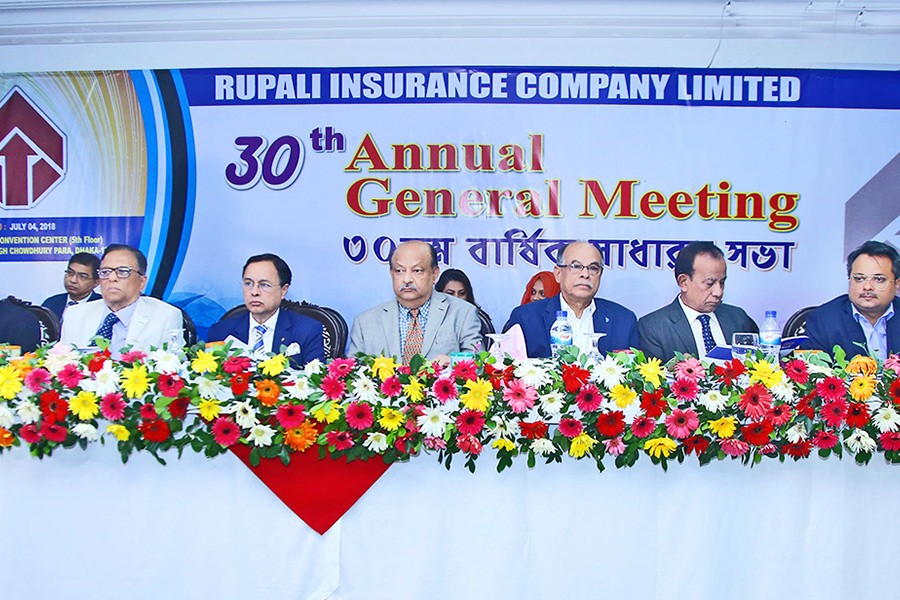 Chairman of Rupali Insurance Company Mostafa Golam Quddus presiding over the 30th annual general meeting (AGM) of the company in the city recently while Management & Financial Consultant M. Azizul Huq and Chief Executive Officer P. K. Roy, FCA were present