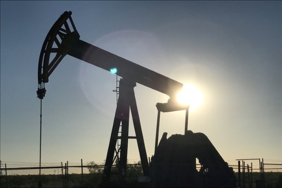 An oil pump jack is seen at sunset near Midland, Texas, US, May 3, 2017. Reuters/File Photo