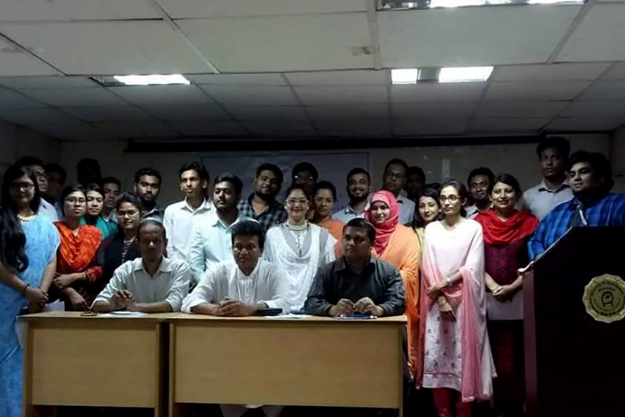 Participants, along with guests, posing for photograph after case study programme at University of Development Alternative (UODA) recently.