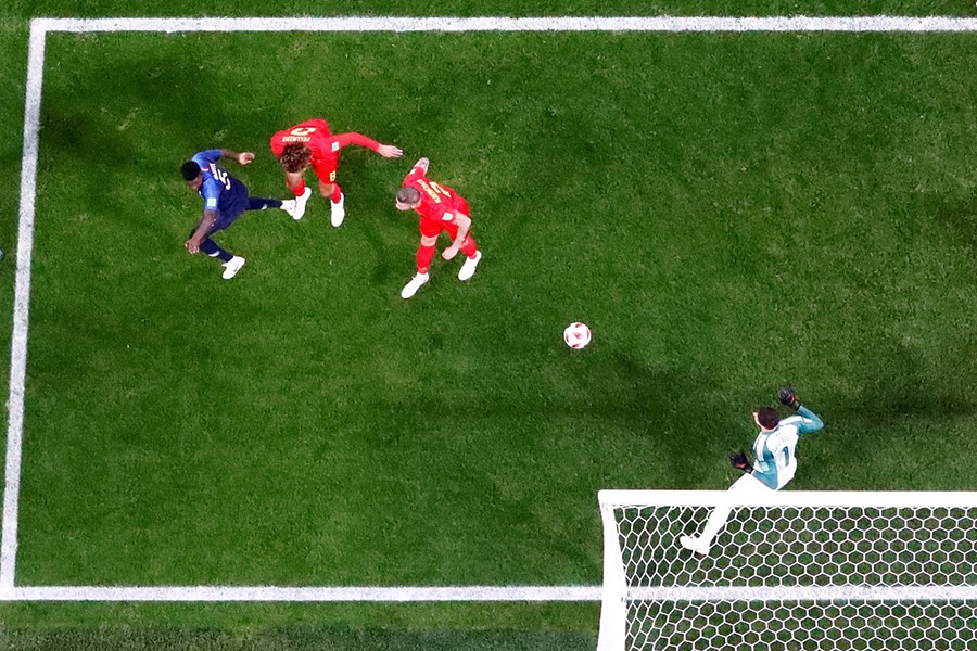 France's Samuel Umtiti scores their lone goal past Belgium's Thibaut Courtois off the Griezmann's corner - Reuters photo