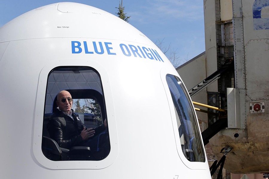 Amazon and Blue Origin founder Jeff Bezos addresses the media about the New Shepard rocket booster and Crew Capsule mockup at the 33rd Space Symposium in Colorado Springs, Colorado, United States April 5, 2017 - Reuters/File