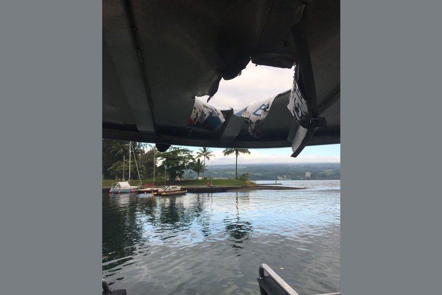 A hole, punched through the roof of a tourist boat, is seen, after lava from the Mount Kilauea volcano exploded in the sea off Kapoho, Hawaii, US July 16, 2018 - Hawaii Department of Land and Natural Resources/Handout via Reuters