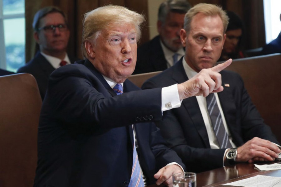 PRESIDENT DONALD TRUMP GESTURES WHILE SPEAKING DURING HIS MEETING WITH MEMBERS OF HIS CABINET IN THE CABINET ROOM OF THE WHITE HOUSE IN WASHINGTON, ON JULY 18, 2018: His toughness with Vladimir Putin in question, President Donald Trump declared on Wednesday he had told the Russian leader face to face to stay out of America's elections "and that's the way it's going to be."  	—AP