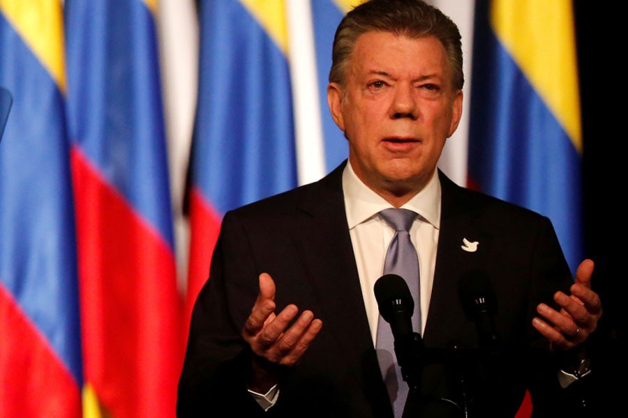 Colombia’s President Juan Manuel Santos gives his speech after signing a new peace accord with Marxist FARC rebel leader Rodrigo Londono, known as Timochenko, in Bogota, Colombia, November 24, 2016 – Reuters photo