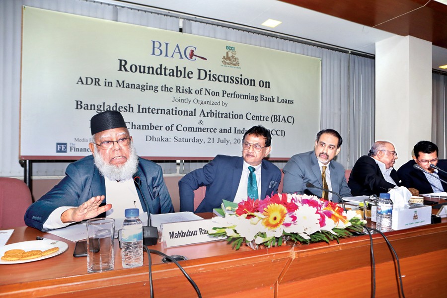 Bangladesh International Arbitration Centre (BIAC) Chairman Mahbubur Rahman addressing a roundtable on "ADR in Managing the Risk of Non Performing Bank Loans," jointly organised by BIAC and DCCI at the conference room of the latter in the city on Saturday — FE photo