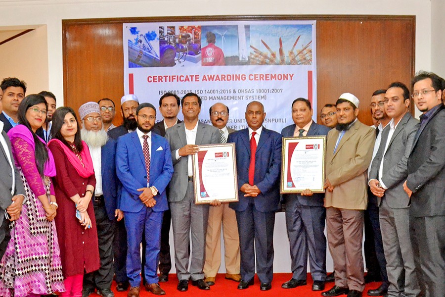 Managing Director of Summit Power Limited Lt Gen Abdul Wadud (Rtd) receiving the IMS certifications from Country Manager, Bureau Veritas Bangladesh (Pvt) Ltd Sohel Azad