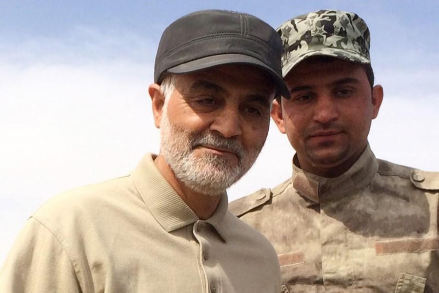 A file photo showing Iranian Revolutionary Guard Commander Qassem Soleimani (left) stands at the frontline during offensive operations against Islamic State militants	— Reuters