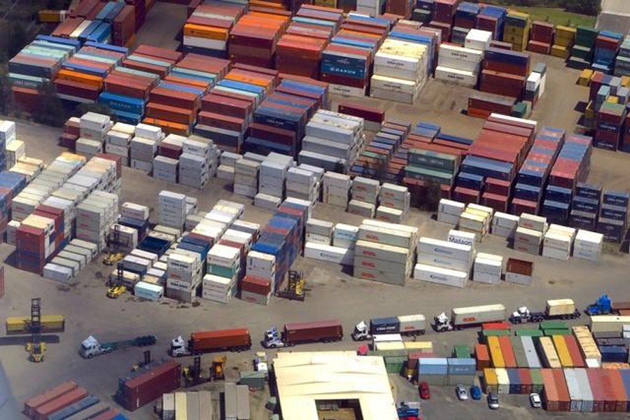 A forklift unloads shipping containers from trucks at a storage facility located near Sydney Airport in Australia   	— Reuters