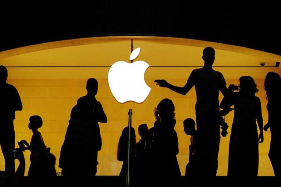 Customers walk past an Apple logo inside of an Apple store at Grand Central Station in New York, US, August 1, 2018. Reuters