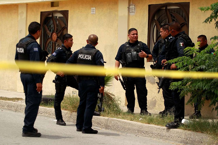 Police officers guard crime scene where bodies were found days before visit of Mexico's President-Elect Andres Manuel Obrador, in Ciudad Juarez, Mexico on Friday