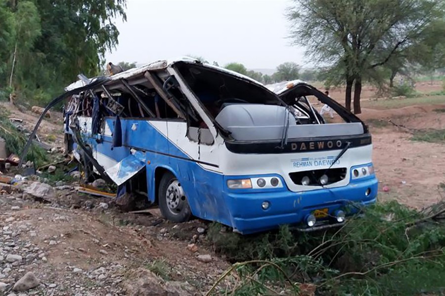 A damaged passenger bus is seen on the site of an accident in Pakistan's northwestern district of Kohat, on Saturday — Xinhua photo