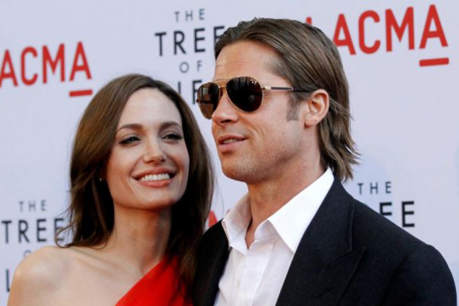 Cast member Brad Pitt and actress Angelina Jolie pose at the premiere of "The Tree of Life" at LACMA in Los Angeles, California, US, May 24, 2011. Reuters/File photo