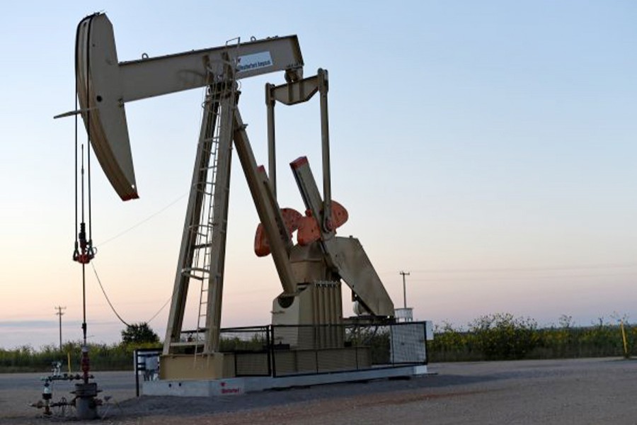 A pump jack operating at a well site leased by Devon Energy Production Company near Guthrie, Oklahoma           	— Reuters