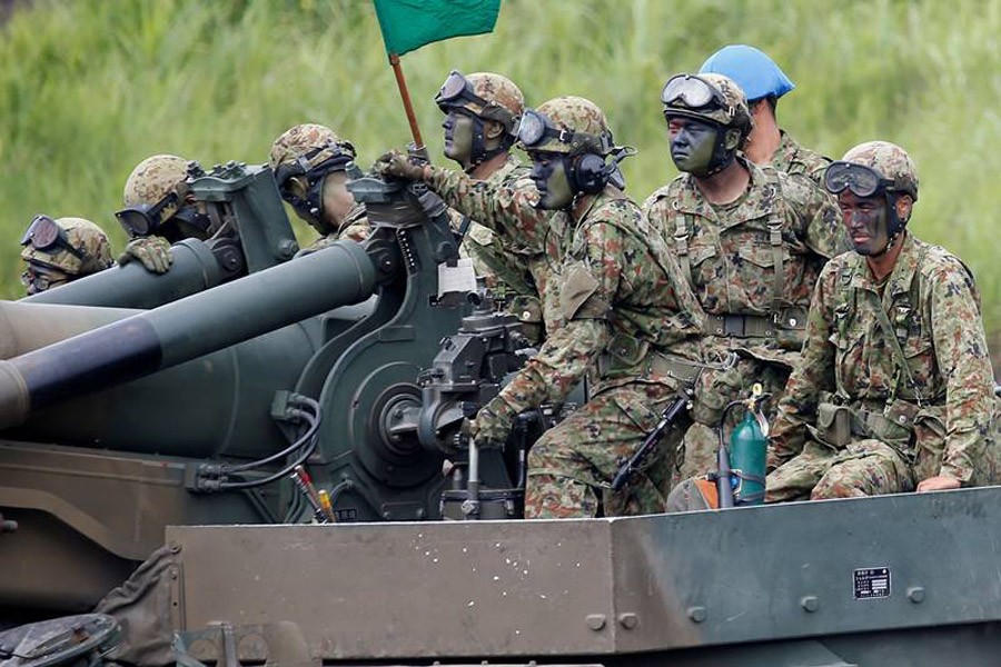 Japanese Ground Self-Defence Force soldiers take part in an annual training session at Higashifuji training field in Gotemba, west of Tokyo – Reuters